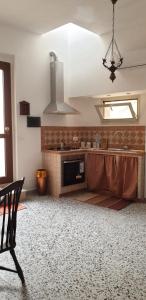 a kitchen with a sink and a counter top at Casa di Sissi in Monterosso Almo +4 photos