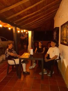 a group of people sitting around a table at HOSPEDAJE CAMPESTRE VILLA PARAISO in Curití