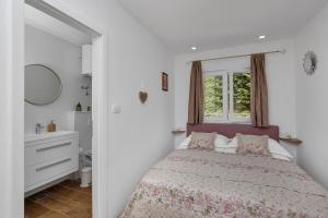 Ένα ή περισσότερα κρεβάτια σε δωμάτιο στο Holiday home Danica +38 φωτογραφίες