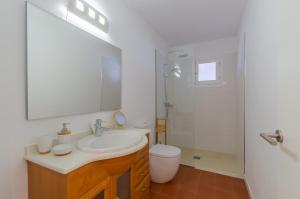a bathroom with a sink and a toilet and a shower at La maison dans la calanque 1 mn à pied de la plage d'ALCAUFAR in Alcaufar +15 photos