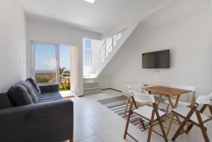 TV a/nebo společenská místnost v ubytování Apartamento no Beach Townhouses 5 por Carpediem