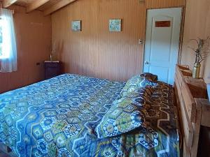 Una cama o camas en una habitación de Petrohue hospedaje Dónde la Nena