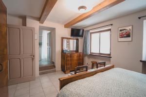 TV a/nebo společenská místnost v ubytování Bed & Breakfast Gabriella EXILLES