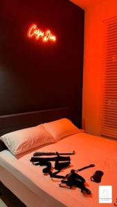 a room with a bed with a camera on it at Hot & Wild Couple Room@Cheras KL in Cheras