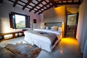 a bedroom with two beds and a large window at Finca Valentina in El Encón +111 photos