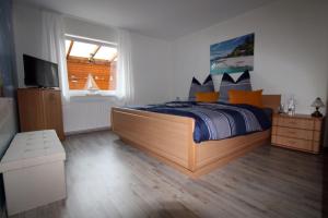 Ένα ή περισσότερα κρεβάτια σε δωμάτιο στο Ferienwohnung Schwallmann