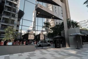 a white car is parked in a building at Yume Vitrali Studios in Sao Paulo