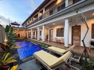 an image of a villa with a swimming pool at Nay's Homestay in Canggu