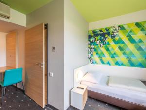 Postel nebo postele na pokoji v ubytování B&B Hotel Erlangen-Süd