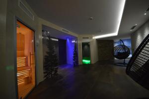 a hallway with blue and green lights in a building at Residence Hotel Anna in Passo del Tonale