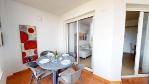 a dining room with a table and chairs at Casa Tintotera- A Murcia Holiday Rentals Property in Roldán
