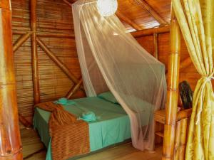 Postel nebo postele na pokoji v ubytování Glamping Río Claro