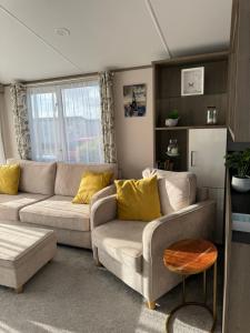 a living room with a couch and a table at Coastguard 45 in Whitstable