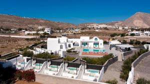 an aerial view of a villa with a swimming pool at Santa Irina Luxury Sunny Lofts in Perivolos