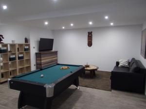 a living room with a pool table and a couch at Apartamento Buen Dia airport Malaga- playa-Torremolinos in Málaga