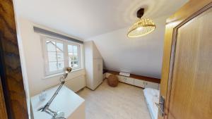 a room with a desk and a window and a lamp at Ô calme Maison familiale - Wickerschwihr in Wickerschwihr +25 photos