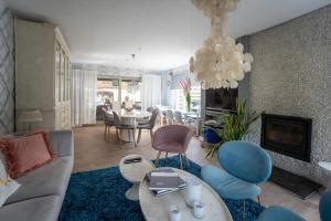 Posezení v ubytování Guesthouse De Witte Merel Deluxe