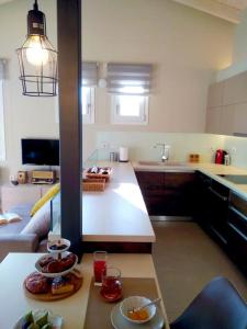 a kitchen with a table with two plates of food on it at Elia boutique apartment in Thiva
