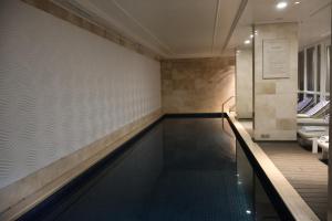 a swimming pool in the middle of a room at Private Luxury Residence 906 at TAJ Cape Town in Cape Town