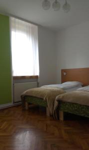 A bed or beds in a room at Guest House Villa Herbarium