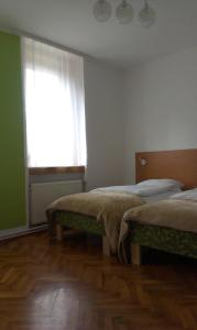 Posteľ alebo postele v izbe v ubytovaní Guest House Villa Herbarium