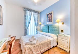 Postel nebo postele na pokoji v ubytování Hotel Hermitage