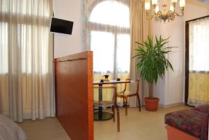 TV a/nebo společenská místnost v ubytování La Chiocciola Apartments