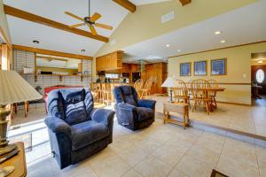 a living room with two chairs and a table at Canal-Front Clay Township Gem Boat and Jet Ski Lift 