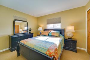 a bedroom with a bed and a large mirror at Canal-Front Clay Township Gem Boat and Jet Ski Lift 