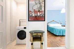 Letto o letti in una camera di Appartamento luminoso di design in centro
