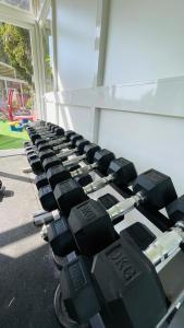 a row of dumbbells lined up against a building at The Red Farm Relais & Spa in LʼInglin