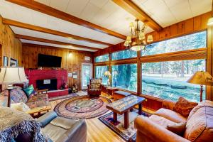 a living room filled with furniture and a large window at 60073 Wallowa Lake Hwy (upper unit) in Joseph
