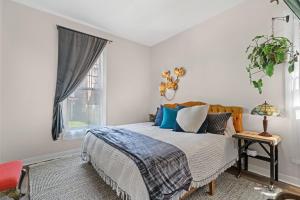 a bedroom with a bed and a window at King Sweet, 2bd, 1 bath, in Historic Walker's Point in Milwaukee