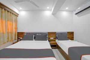 Katil atau katil-katil dalam bilik di HOTEL TAPOVAN IN