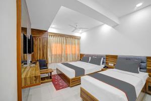 Katil atau katil-katil dalam bilik di HOTEL TAPOVAN IN