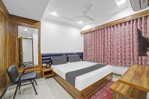 Katil atau katil-katil dalam bilik di HOTEL TAPOVAN IN