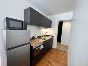 Kuchyň nebo kuchyňský kout v ubytování Appartement Climatisé / Centre-ville / 4 personnes