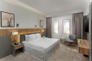 Cama ou camas em um quarto em Ewan Dar Alhejra Hotel