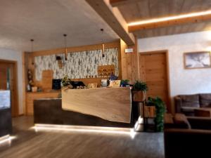 a restaurant with a counter in a room at Hotel Valle Pesio Ristorante in Chiusa di Pesio