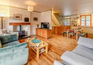 a living room with two couches and a table at The Counting House in Fowey