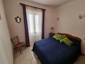Ένα ή περισσότερα κρεβάτια σε δωμάτιο στο Maison de village Casa del Puig