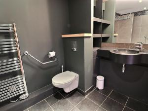 a bathroom with a toilet and a sink at Charmant 2 pièces cabine skis aux pieds, parking inclus - FR-1-182-245 in Les Allues +20 photos