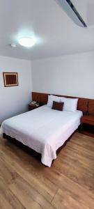 Postel nebo postele na pokoji v ubytování Faraona Grand Hotel