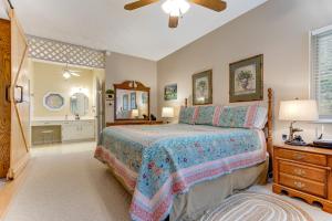 a bedroom with a bed and a bathroom with a sink at 2 Bed 2 Bath Vacation home in Whittier I in Whittier