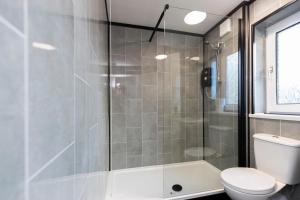 a bathroom with a shower and a toilet at Stanhope House in Stockton-on-Tees +18 photos