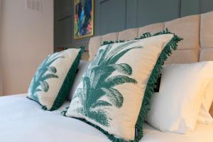 a bed with two pillows on top of it at Stanhope House in Stockton-on-Tees