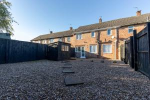 a yard with stepping stones in front of a house at Stanhope House in Stockton-on-Tees
