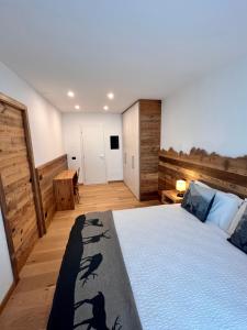 מיטה או מיטות בחדר ב-Casa Salvaterra Suite 44