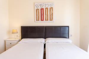 Posteľ alebo postele v izbe v ubytovaní Villas y Apartamentos El Sultan