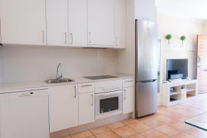 Kuchyňa alebo kuchynka v ubytovaní Villas y Apartamentos El Sultan